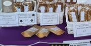 Image shows a table of various types of wheaten bread