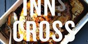 An image of the Inns Cross in words across an image of food
