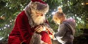 Santa chats to a little girl at Carryduff Christmas Market