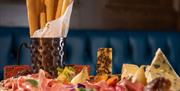 A platter of cheese and meats served at Hinch Brasserie