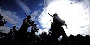 An image of pipers playing together