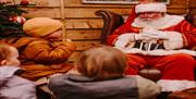 Image shows Santa and Children.