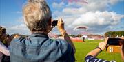 Spectators watching paragliding