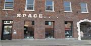 Image shows a red brick art Gallery