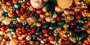 Image is of colourful Christmas decorations