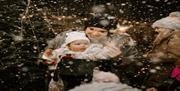 Image shows baby in the snow.
