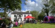 Seating area, BBQ and bouncy castle at the front of The Ballance House