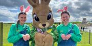 Image shows staff at Streamvale Farm dressed up for Easter with the Easter Bunny.