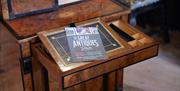 Flyer on wooden plynth