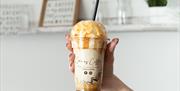 An image of a milkshake with ice cream