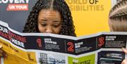 Student reading information sheet