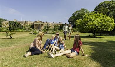 Family on grass at Hillsborough Castle