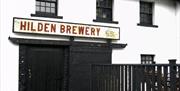 Image shows outside of building with Hilden Brewery above the doorway