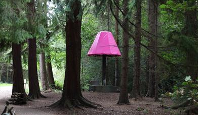 The Lamp sculpture through the trees in Hillsborough Forest Park