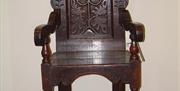 Image shows single antique wooden chair