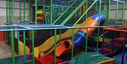 Indoor soft play area with slides