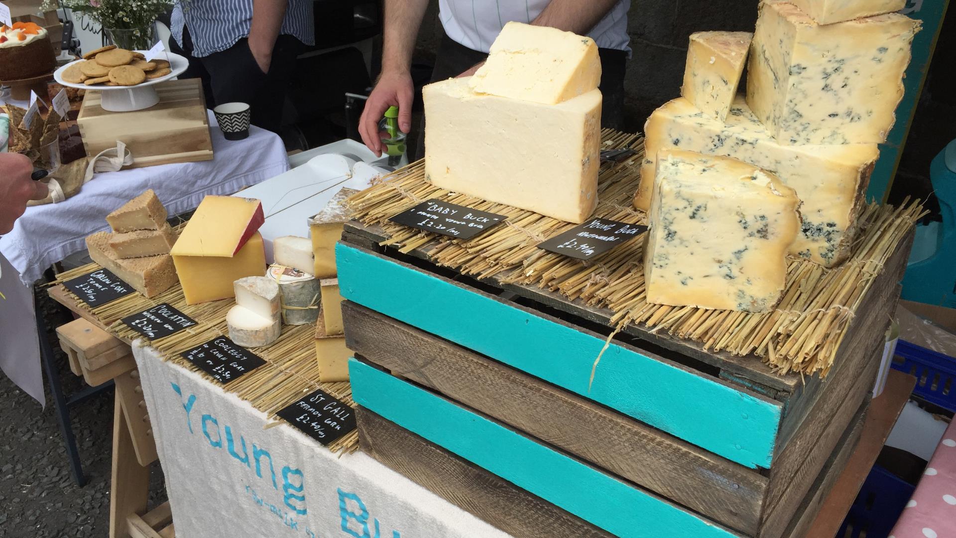 Image shows a stall showing a selection of cheese