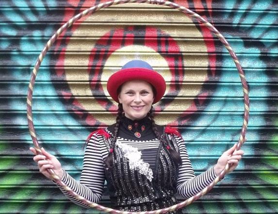 An image of a lady from Circusful holding a hoop