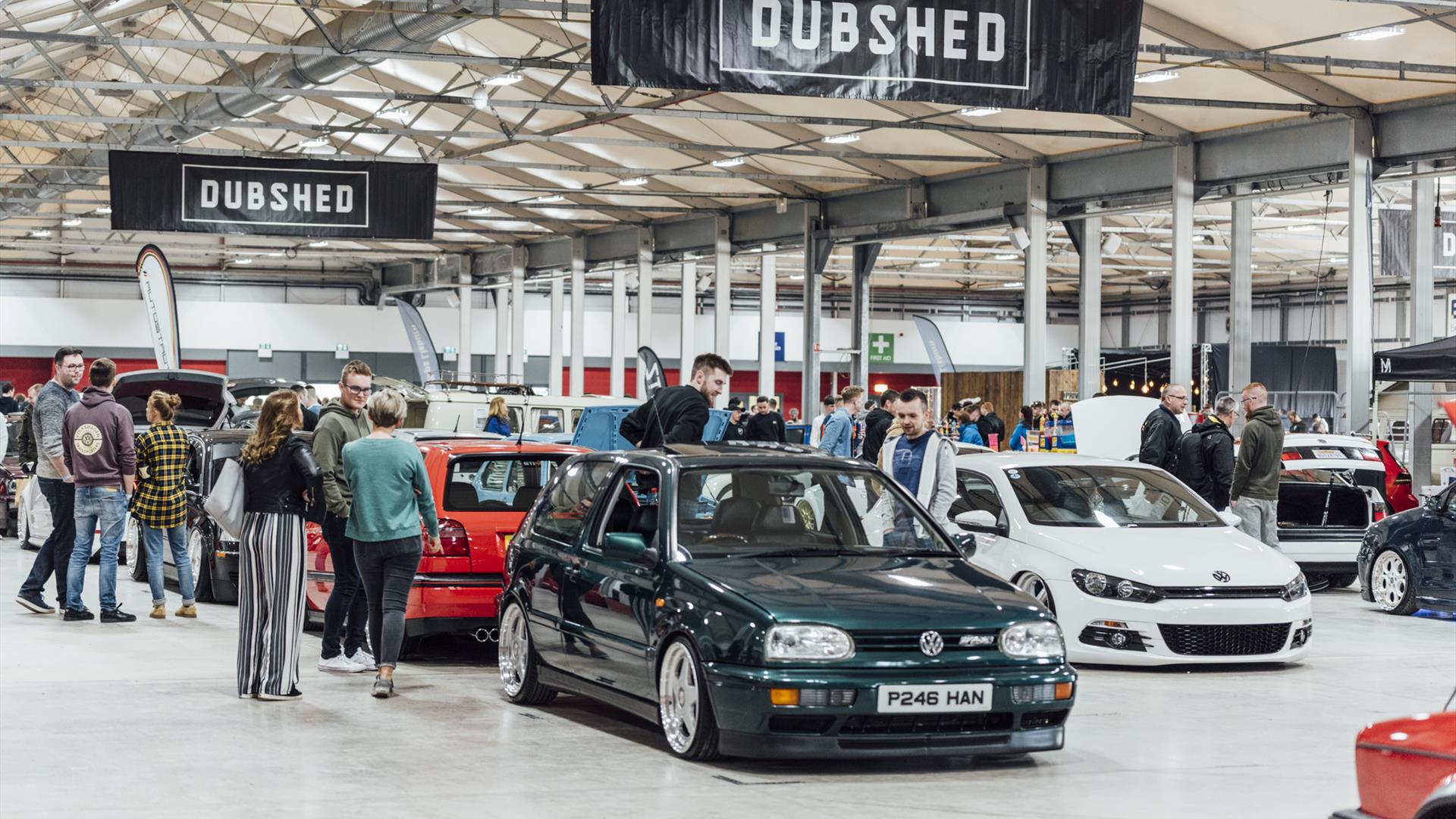 Image is of various cars and visitors at the Dubshed show at Eikon Exhibition Centre