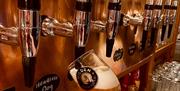 Image is of a beer being pulled on tap at Hilden Brewery