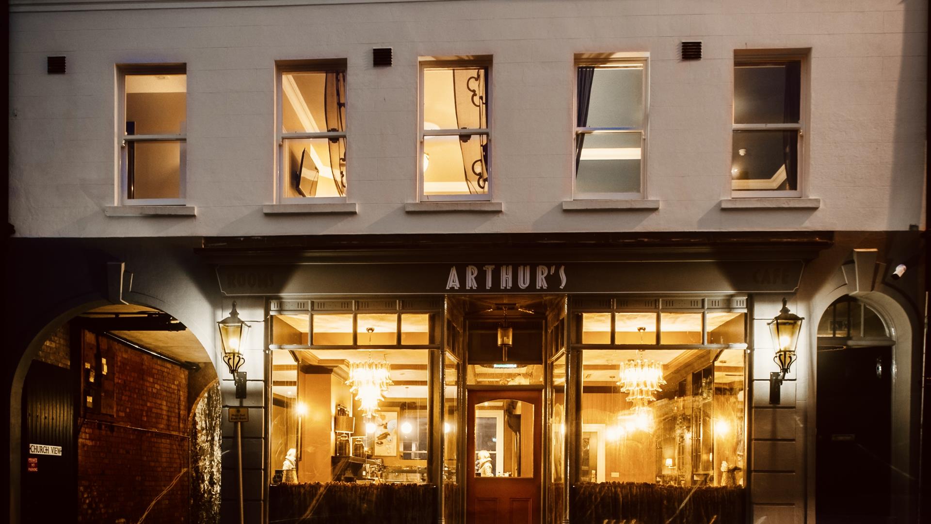 An image of the exterior of Arthur's in the evening