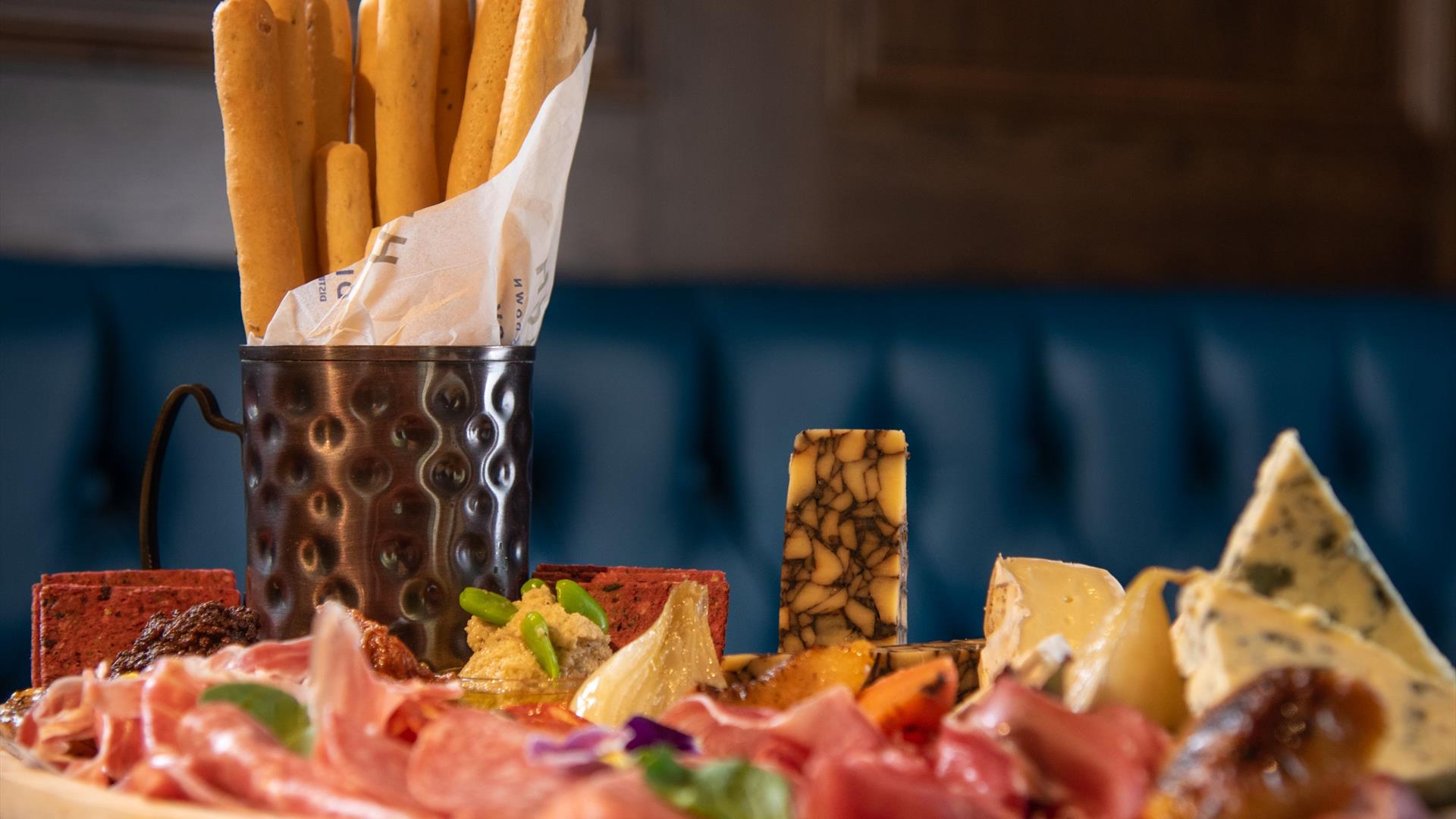 A platter of cheese and meats served at Hinch Brasserie