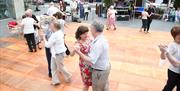 Couples dancing in Market Square