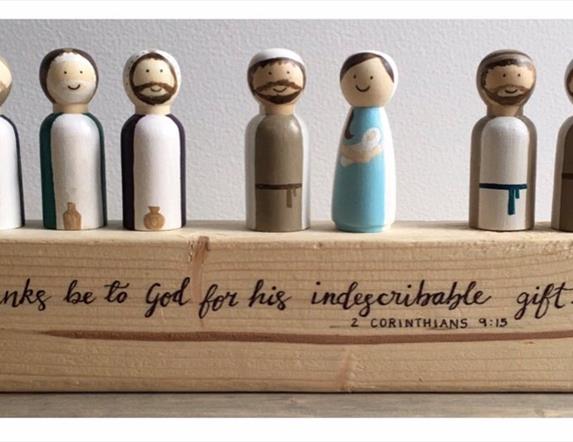 Image is of a wooden nativity set made by artist Sandra Shaw