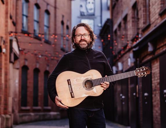 Image is of Paddy Anderson and his flamenco guitar