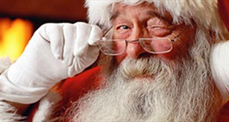 Santa looking over his glasses