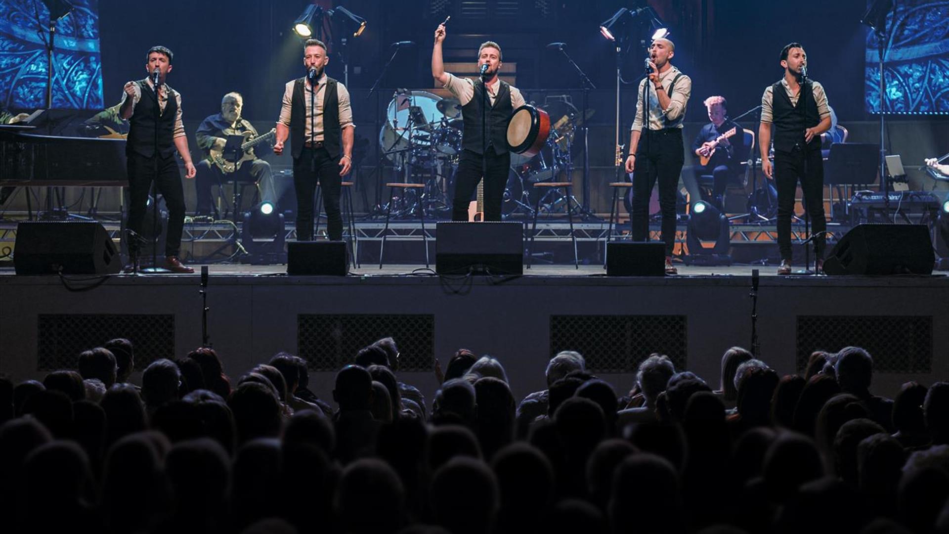 Image is of the members of the Shamrock Tenors on stage