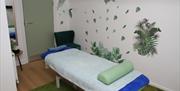 Image is of a treatment room at Therapy Zone