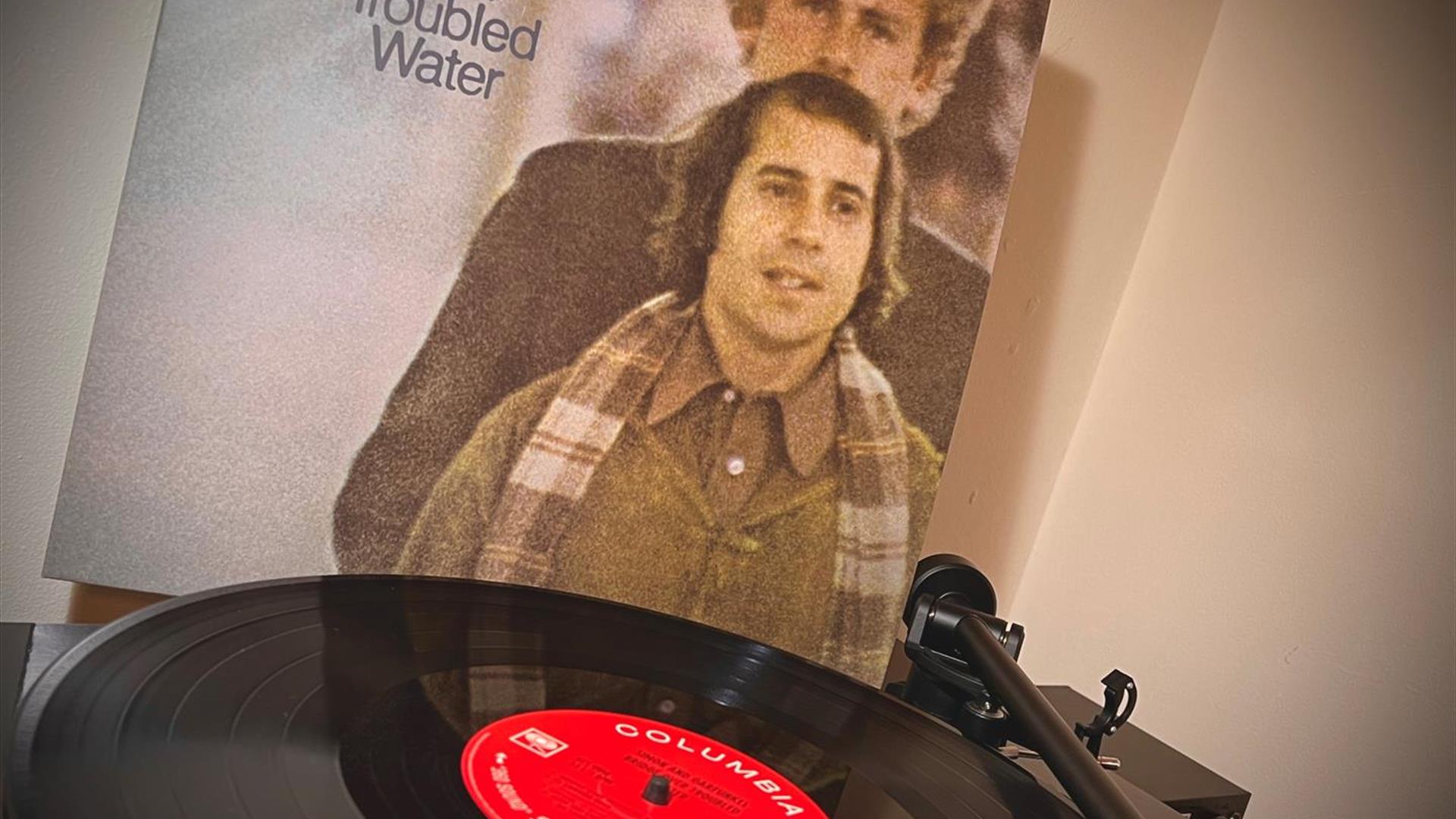 Bridge Over Troubled Water Album cover showing a visual image of Simon & Garfunkel with a record player to the fore