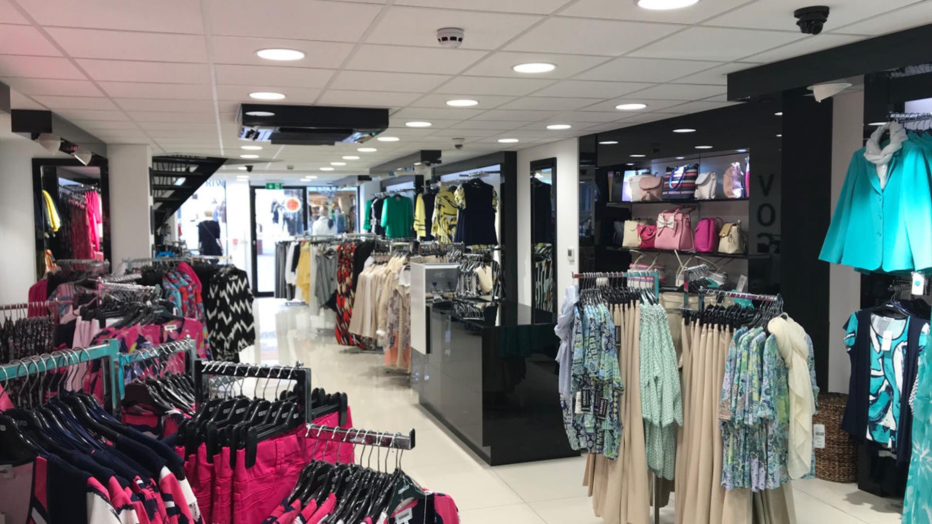 Inside Vogue Lisburn, clothing racks and handbags Inside Vogue Lisburn, clothing racks and handbags
