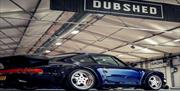 Dark Blue Car with Dubshed sign above it