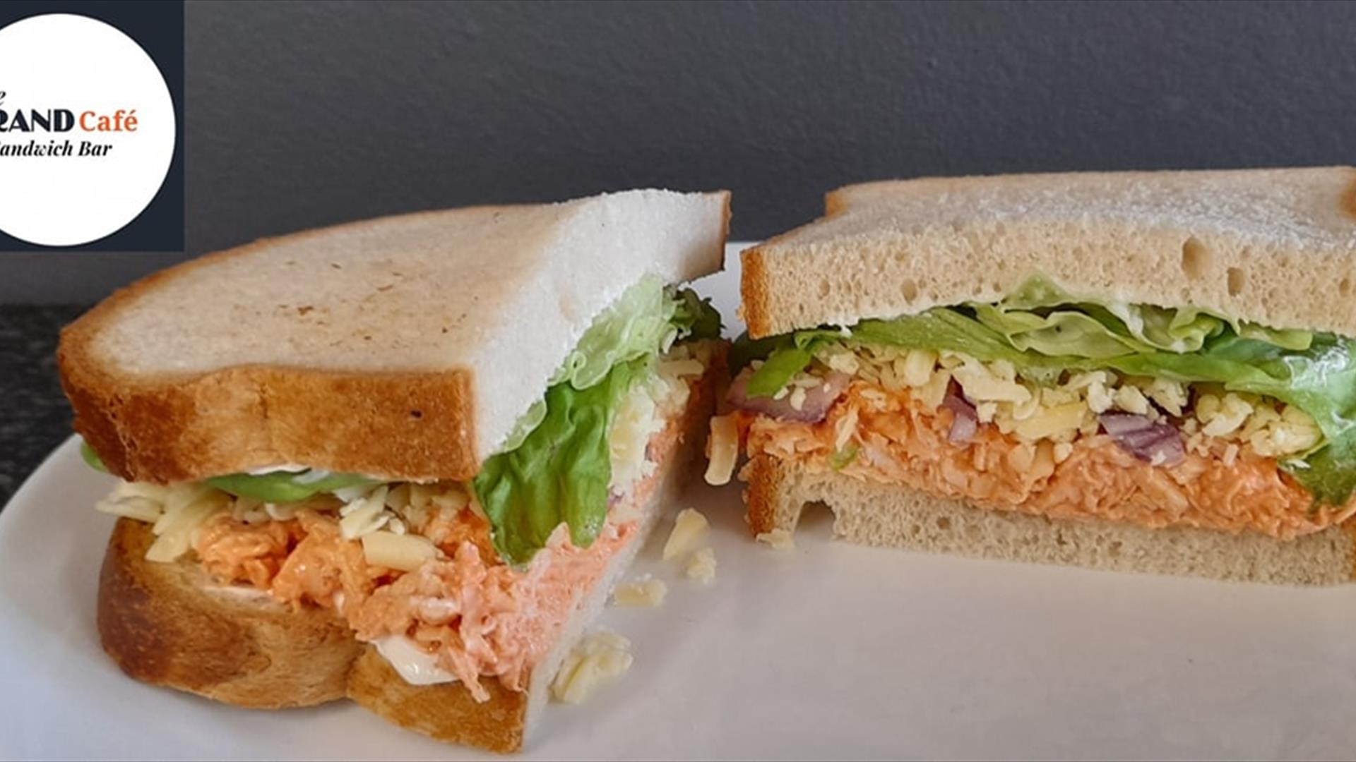 Image shows two sandwiches with a variety of fillings.